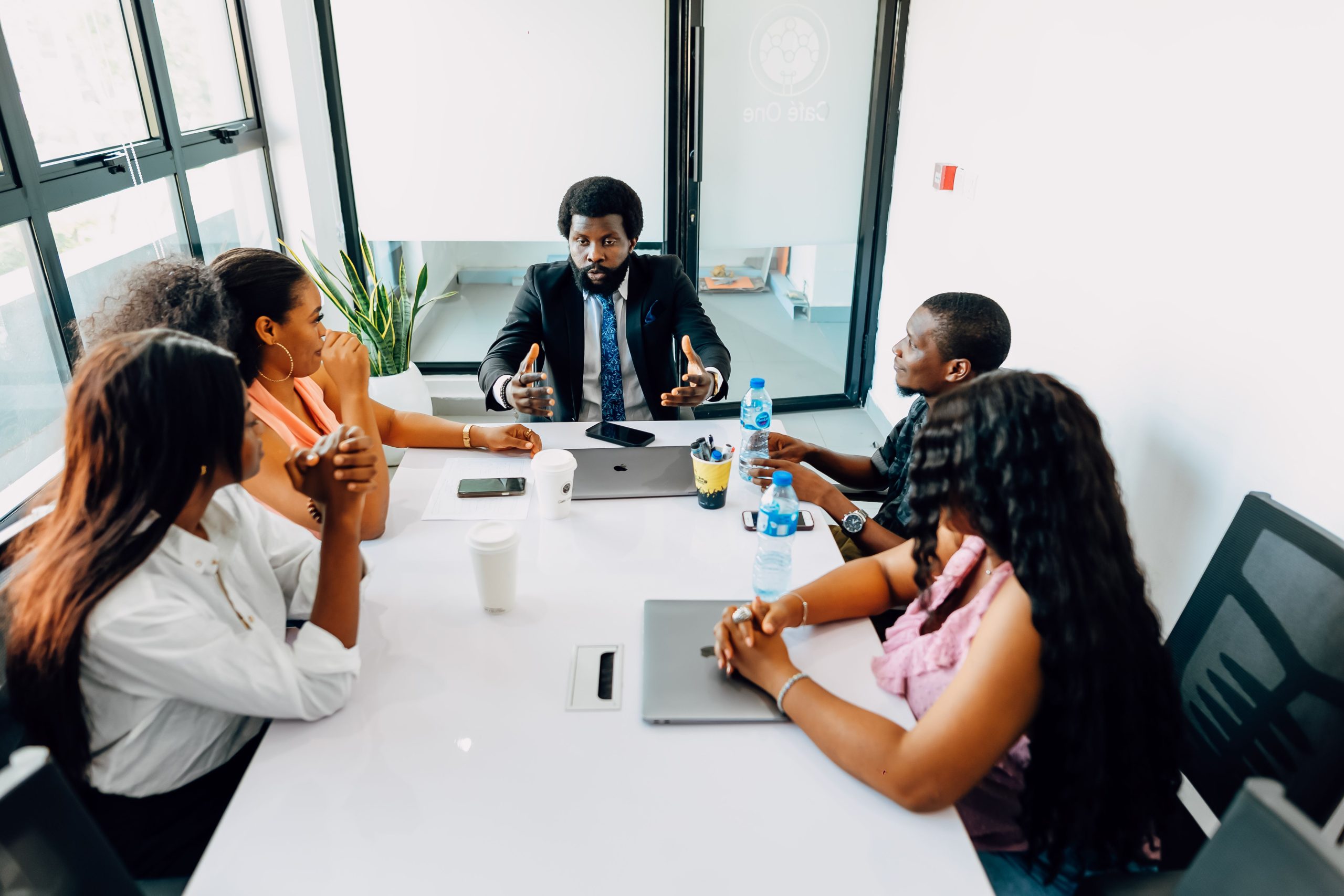 Corporate team engaged in a collaborative business meeting in a modern office in Lagos, Nigeria.